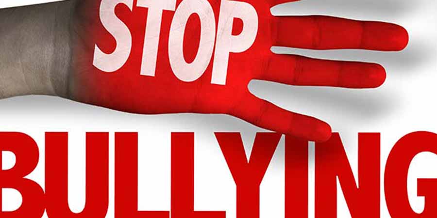 A red hand with 'Stop Bullying' written on it
