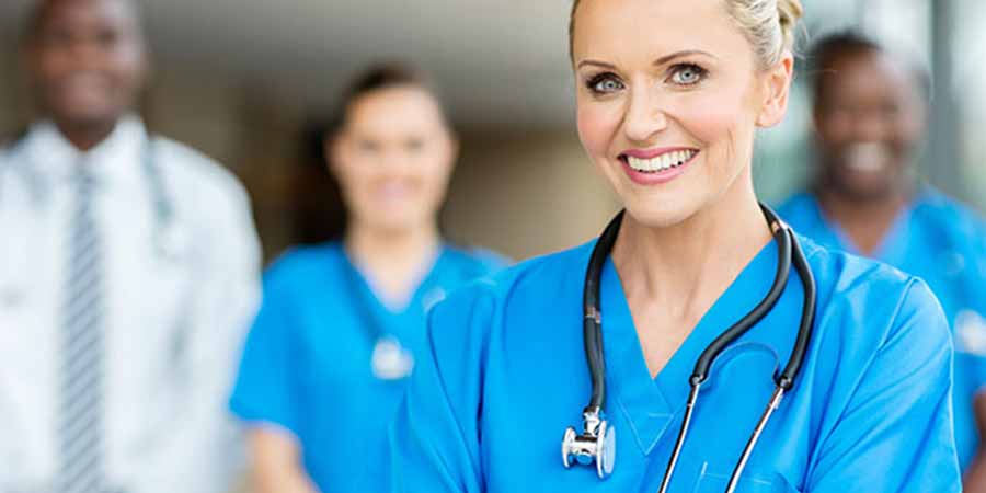 Group of medical professionals with a Nurse in the foreground.