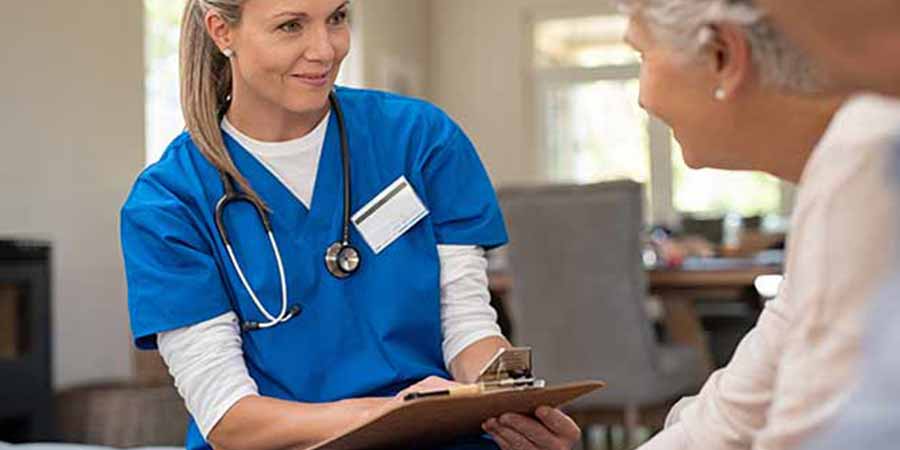 Nurse consulting with her patients.