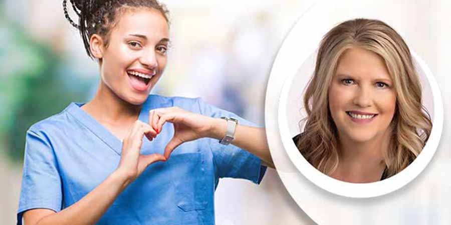 A nurse making the shape of a heart with her two hands