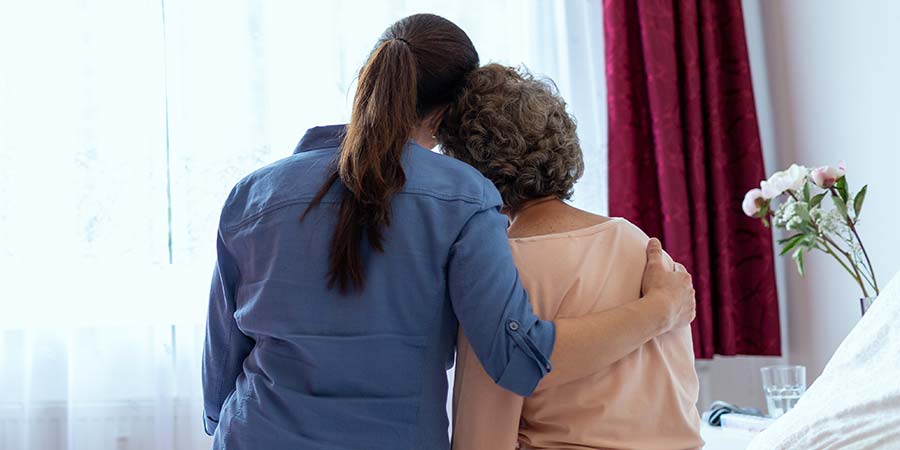 Nurse providing support to her patient.