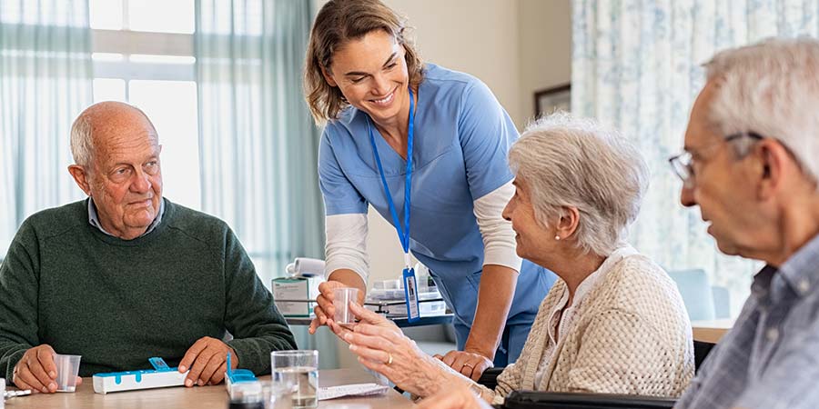 Nurse patiently helping patients with their healthcare.