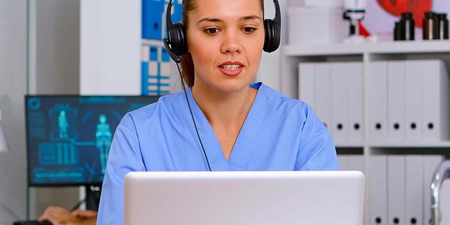 Nurse listening intently to a nursing ceu audio course.